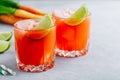 Carrot Ginger Margarita cocktail with lime in glass