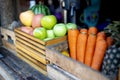 Carrot green red apple in the Wooden crate