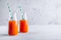 Carrot juice. Fresh organic detox carrot juice in glass bottles Royalty Free Stock Photo