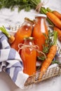 Carrot juice. Fresh organic raw vegetable detox beverage in bottles Royalty Free Stock Photo