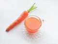 Carrot and carrot juice over white background Royalty Free Stock Photo