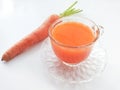 Carrot and carrot juice over white background Royalty Free Stock Photo