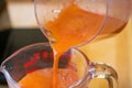 Carrot Juice Being Poured