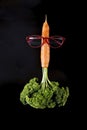 carrot looking like a rocket with eye glasses and parsley flames, launching.