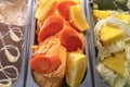 Carrot and orange ice cream. Various ice creams in tray in the ice cream shop top view
