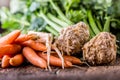 Carrot parsnip celery. Celery carrot and parsnip on rustic oak table Royalty Free Stock Photo