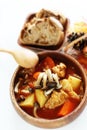 Chicken red soup and mushroom curry in white bowl