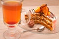 Carrot slice cake and a cup of tea Royalty Free Stock Photo