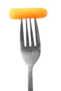 Carrot slice on fork isolated on white background Royalty Free Stock Photo