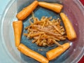 Selective focus carrots pieces in a circle shape and carrots skin in the middle Royalty Free Stock Photo