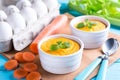 carrot souffle with celery on wooden table