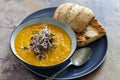 Carrot soup with green sprouts