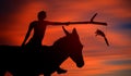 Carrot Stick Theory Concept With Donkey Silhouette. Man Riding The Mule. Royalty Free Stock Photo