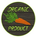 Carrot on a wooden surface with an inscription - organic product