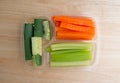 Carrots celery and cucumbers in a plastic tray