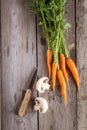 Carrots and champignon on old boards