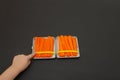 Carrots in a cigarette case. Smoking cessation concept, role model for children
