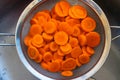 Carrots cut in a sieve