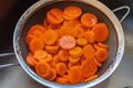 Carrots cut in a sieve