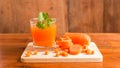 Carrots, Delicious sweet drink fresh carrot juice with coriander leaves Royalty Free Stock Photo