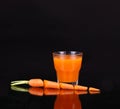 Carrots and juice in a glass Royalty Free Stock Photo