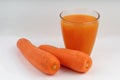 Carrots and juice in a glass white background Royalty Free Stock Photo