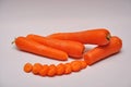 Whole and sliced carrots on a seamless background Royalty Free Stock Photo