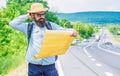 Carry good map. Tourist backpacker looks at map choosing travel destination at road. Allow recognize enough details to Royalty Free Stock Photo