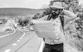 Carry good map. Tourist backpacker looks at map choosing travel destination at road. Allow recognize enough details to Royalty Free Stock Photo