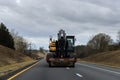 Carrying heavy construction equipment on a trailer Royalty Free Stock Photo