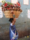 Carrying a heavy load of fresh flowers Dadar flower market Mumbai India