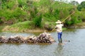 Carrying sugarcane by a bamboo raft