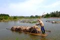 Carrying sugarcane by a bamboo raft