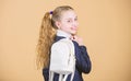 Carrying things in backpack. Schoolgirl ponytails hairstyle with small backpack. Learn how fit backpack correctly. Girl Royalty Free Stock Photo