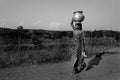 Carrying water Royalty Free Stock Photo