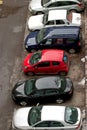 Different cars parked in a parking line 