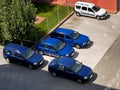 Different cars parked in a parking line 