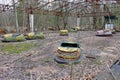 Cars in an abandoned amusement park in Pripyat. Rusty deserted attractions