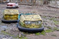 Cars in an abandoned amusement park in Pripyat. Rusty deserted attractions