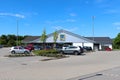 Cars around a small patch of grass at Aldi Sud in Germany