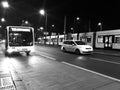 Cars bus and trams running in a busy city streets at night Berlin