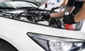 Cars in a carwash. Car wash with foam at station. Carwash. Washing at the station. Car washing concept. Car detailing. A man clean Royalty Free Stock Photo