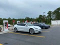 Cars charging at a Tesla Supercharger Station in Florida