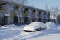 Cars covered in snow near the house Royalty Free Stock Photo