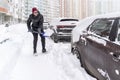 Cars covered with snow in the parking lot of a residential building after a blizzard Royalty Free Stock Photo