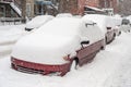 Cars covered in snow during snowstorm Royalty Free Stock Photo