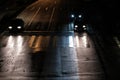 Cars at a crossing at night