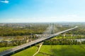 Cars drive on cable-stayed bridge under clear blue sky Royalty Free Stock Photo