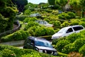 Cars drive down Lombard Street switchback in San Francisco CA Royalty Free Stock Photo