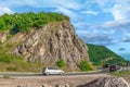 Cars drive fast along the M2.3 highway in the mountains near Budva